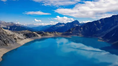 Aerial View Of A Vibrant Blue Alpine Lake