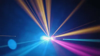Colorful Stage Lights Beaming Through Haze