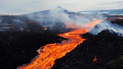 Molten Lava Flowing Through Volcanic Landscape