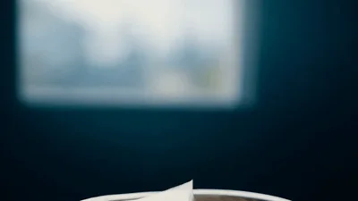 Crumpled Paper Ball Falling Into A Wastebasket