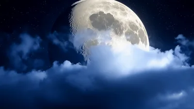 Full Moon Rising Behind Moving Night Clouds