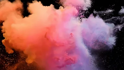 Colorful Powder Explosion Against A Black Background