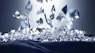 Diamonds Falling Onto Dark Fabric Surface