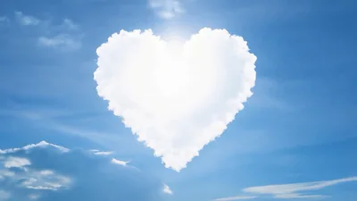 Heart Shaped Cloud With Sun Shining Through
