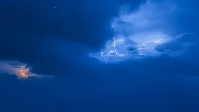 Lightning Flashes Inside Dark Storm Clouds