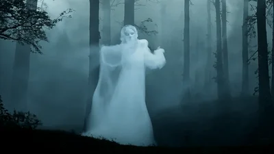 Ethereal Ghostly Woman Floating In Dark Misty Forest