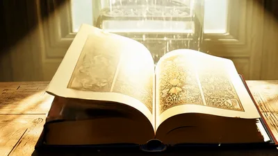Antique Magical Book Opening On Wooden Table