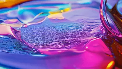 Iridescent Liquid Pouring Into Colorful Viscous Pool