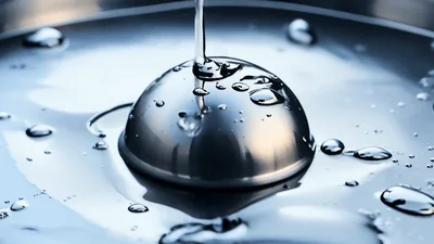 Metal Sphere Dropping Into Liquid Mercury Surface