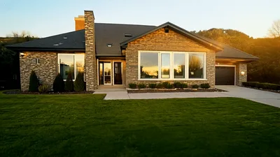 Modern Stone House Exterior During Golden Hour Sunset