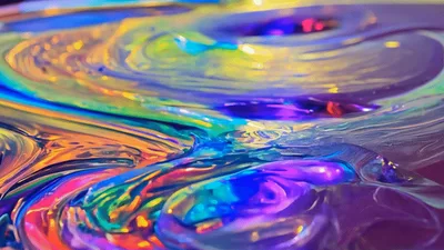 Abstract Iridescent Liquid Paint Swirling In Slow Motion