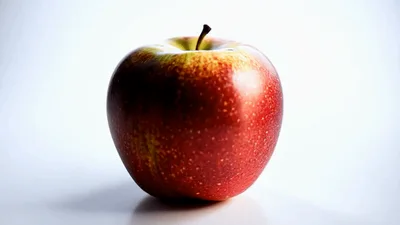 Red Apple Rotating Slowly on White Background