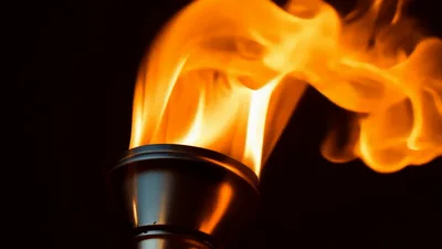 Olympic Torch Burning With Bright Orange Flames