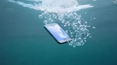 Smartphone Falling Into Deep Blue Ocean Water