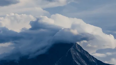 Time Lapse Of Clouds Moving Over Mountain Peak