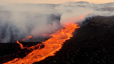 Aerial View Of Molten Lava Flowing Through Volcanic Landscape