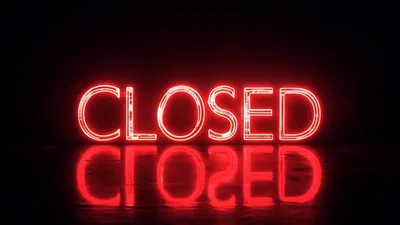 Red Neon Closed Sign Flickering On Dark Background
