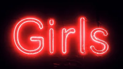 Red Neon Girls Sign Flickering On Dark Background