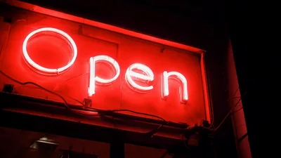 Bright Red Neon Open Sign Glowing At Night