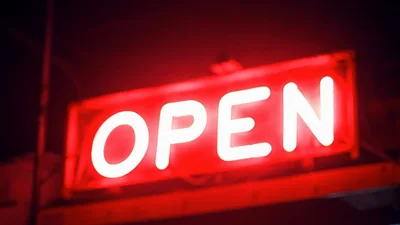 Red Neon Open Sign Flickering On At Night