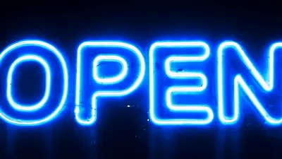 Blue Neon Open Sign Flickering On Dark Background