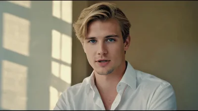 Handsome Young Man Looking At Camera In Bright Room