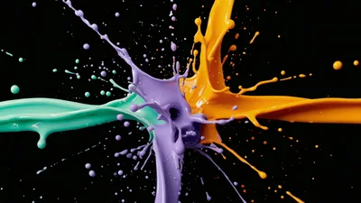 Colorful Paint Splashes Colliding Against Black Background