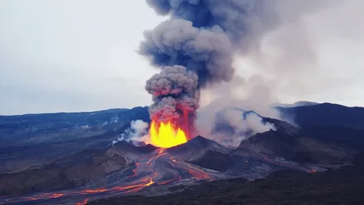 Volcanic Eruption With Lava Flows And Ash Plume
