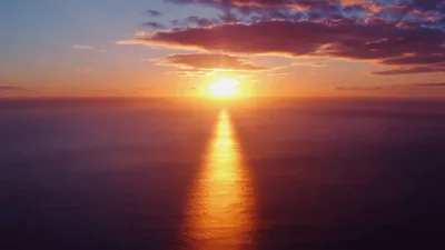 Golden Sunset Over Calm Ocean Horizon