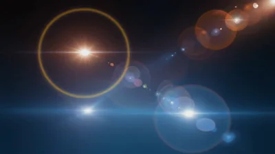 Abstract Lens Flare Light Effects On Dark Background