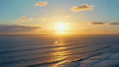 Golden Sunset Over The Pacific Ocean Waves