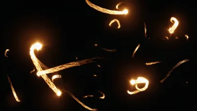 Abstract Glowing Golden Light Trails Moving In Darkness