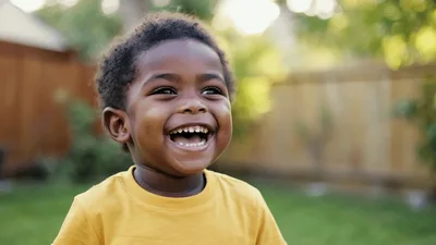 Happy Toddler Boy Laughing Outdoors
