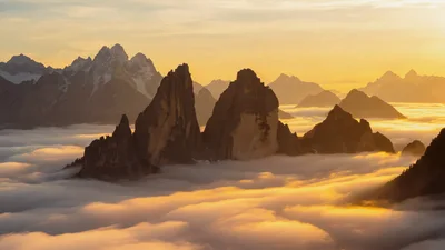 Majestic Dolomite Mountains Rising Above A Sea Of Clouds