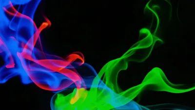 Abstract Colorful Smoke Swirls On Black Background