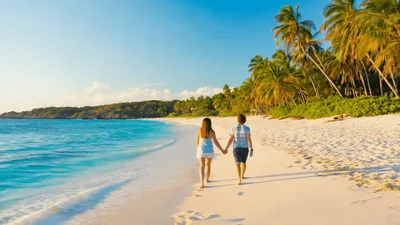 Couple Walking Hand In Hand On Tropical Beach