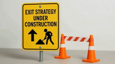 Exit Strategy Under Construction Sign With Traffic Cones