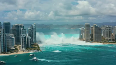 Massive Tsunami Wave Approaching Coastal City Skyline