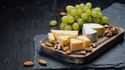 Gourmet Cheese Platter With Grapes And Nuts
