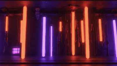 Hanging Neon Tubes Glowing In Dark Industrial Setting