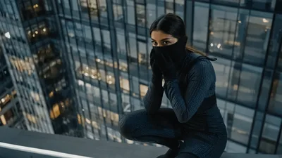 Female Spy Crouching On Skyscraper Rooftop At Night