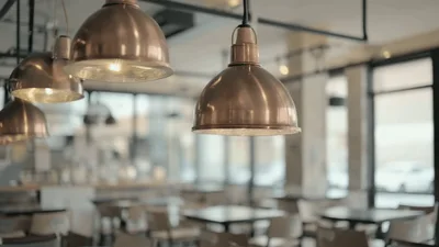 Copper Pendant Lights Hanging In A Modern Cafe Interior