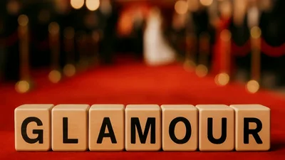Glamour Text On Wooden Blocks On Red Carpet