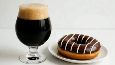 Glass Of Dark Stout Beer And Chocolate Glazed Donut