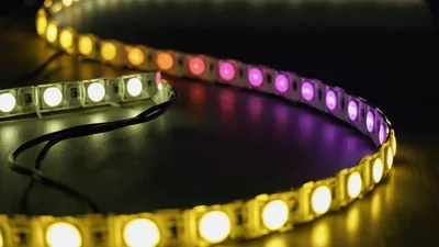 Flexible LED Strip Lights Changing Colors On Dark Surface