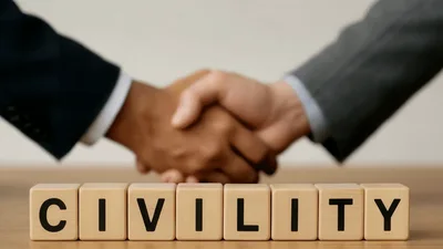 Business People Shaking Hands Behind Civility Wooden Blocks