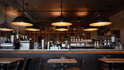 Steam Rising From Espresso Machine In Coffee Shop