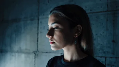 Young Woman Looking Thoughtfully Into The Distance