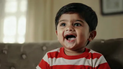 Happy Toddler Boy Smiling And Looking Around
