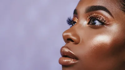 Beautiful Woman With Glitter Makeup Blinking Her Eyes
